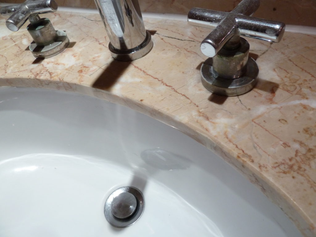 Damaged marble sink after repairs
